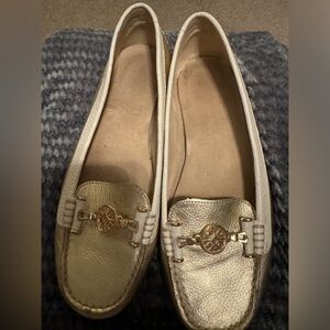 Women’s gold and cream loafers